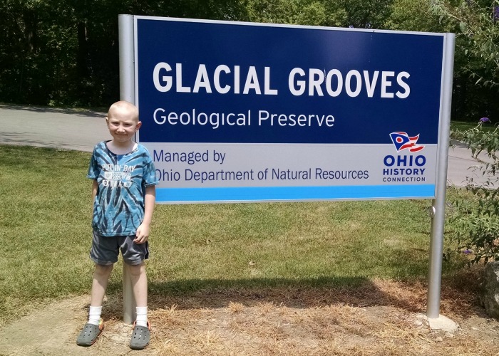 Glacial Grooves sign with Big Red
