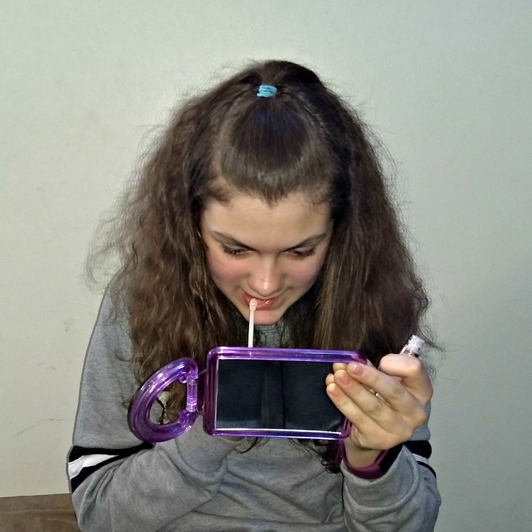 Princess applying lip shine